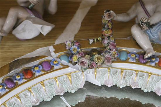 A Meissen porcelain dressing table mirror, surmounted with cherubs (a.f.), overall height 56cm